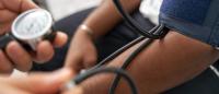 Nurse checking blood pressure